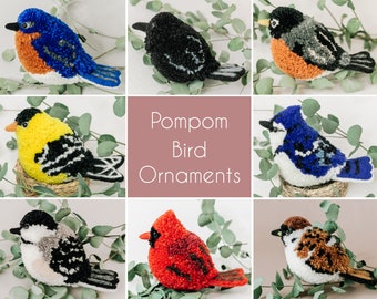 May include: Nine colourful pom-pom bird ornaments, including a bluebird, cardinal, robin, goldfinch, chickadee, and sparrow. The birds are arranged in a collage with a title card that reads "Pompom Bird Ornaments".