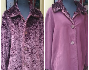 May include: A burgundy faux fur coat with a large collar and button closure. The coat has a smooth, velvety texture and is lined with a contrasting fabric.