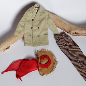 May include: A beige corduroy jacket with brown buttons, red scarf, striped trousers, and a straw hat.