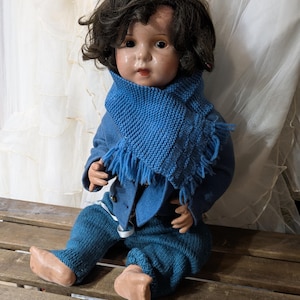 Antique baby doll composition with clothes