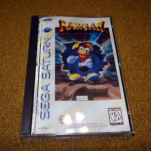 Custom printed Sega Saturn Rayman manual, and case insert