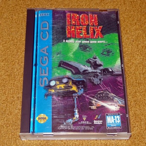 May include: A Sega CD game case for Iron Helix, a futuristic war game. The case is blue and black with a picture of a spaceship and a futuristic vehicle. The game is rated MA-13.
