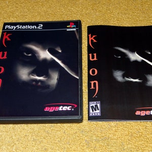 May include: PlayStation 2 video game case and instruction manual for the game "Kuon". The case is black with a red and white "Kuon" logo and a picture of a woman's face. The manual is black with a red "Kuon" logo and a picture of a woman's face.