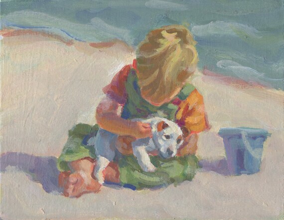 little boy holding dog painting