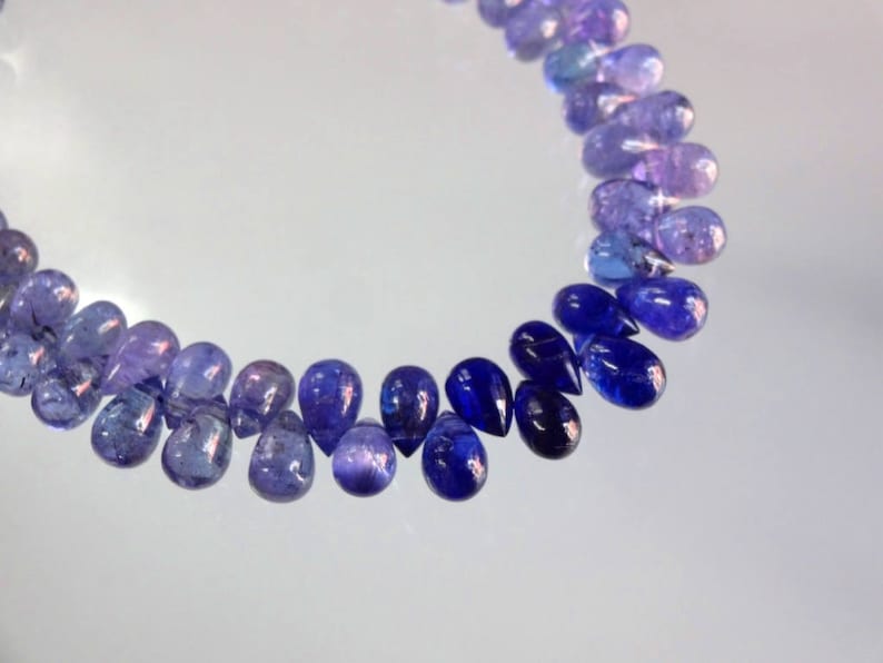 8-inch AAA quality Tanzanite smooth plain teardrop size 6.5-7mm 81cts GW3015