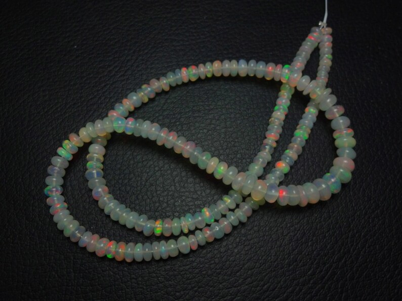 Natural AAA quality Ethiopian Opal smooth plain rondelle beads size 4.5-5.75mm sold per 16-inch strand GW884