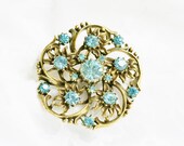 Coro mid century blue rhinestone, antiqued gold tone metal, brooch set