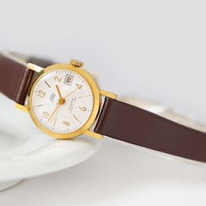 Unbenutzte Damen Armbanduhr minimalistisch ZARIA. Klassische Mädchenarmbanduhrschmucksachen vergoldetes Geschenk. Preppy zarte Armbanduhr. Neues Premium-Lederband