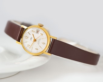 Authentic Women's Watch Gold Plated unused ZARIA mid size wristwatch retro numerals dial, date window, jewellery Gift, New Leather Strap