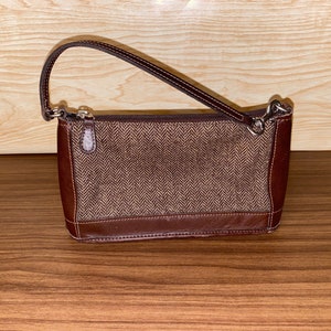 Monedero de entrenador /Embrague con capacidad de pulsera : 1999