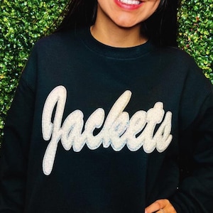 Toppa applicata a caldo in ciniglia bianca per giacche