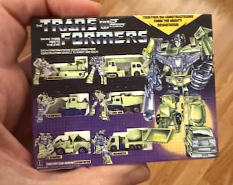 Adorno navideño vintage original Hasbro G1 Transformers DEVASTATOR con imán en miniatura para caja de juguetes