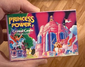 Adorno navideño/imán para nevera de la miniatura del Castillo de Cristal de She-Ra, Princesa del Poder, de Mattel MOTU (Motu). Original de época. Caja de juguete. Figura de She-Ra, Princesa del Poder. Imán para nevera.