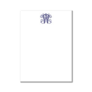 May include: A white notepad with a blue monogram of the letter "W" in a decorative font.