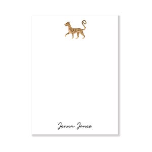 May include: White notepad with a cheetah illustration and the name "Jenna Jones" printed at the bottom.