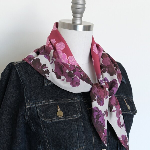 A beautiful floral scarf with vibrant colors and intricate patterns