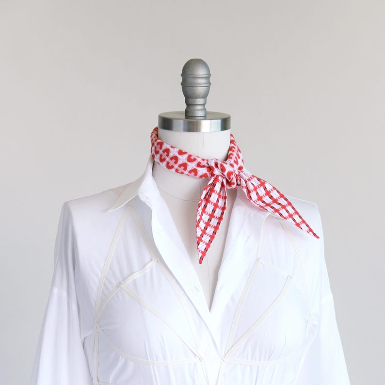 Seersucker cotton red plaid skinny diamond scarf shown tied as a neckerchief on a mannequin in a white blouse.