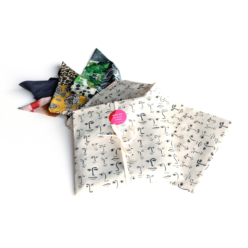 Photograph of our reusable cotton face print handmade cotton pouch that scarves are delivered in.