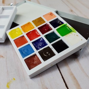 Watercolor Travel Palette 2.5 square x 1/2 inches. Hold 25 colors & 9 colors Thick