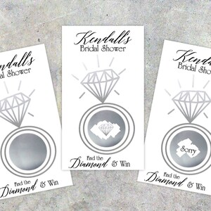 May include: Three white cards with a silver ring and diamond design. Each card has the text "Kendall's Bridal Shower" and "Find the Diamond & Win". One card has a silver diamond under the scratch-off area, one card has the word "Sorry" under the scratch-off area, and one card has a blank scratch-off area.