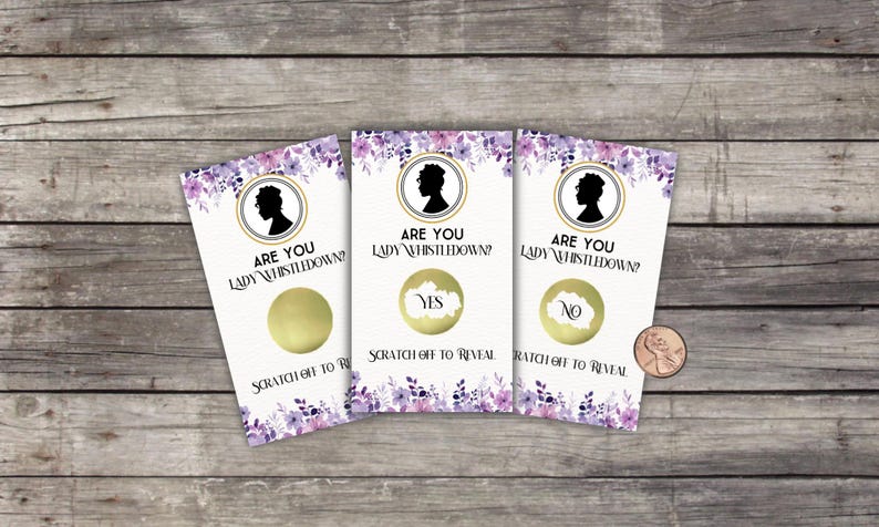 May include: Three scratch-off cards with a floral design and the text "ARE YOU LADY WHISTLEDOWN?" Each card has a gold circle to scratch off, revealing "YES" or "NO". A penny is next to the cards.