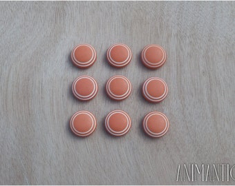 nine vintage orange plastic buttons 1960