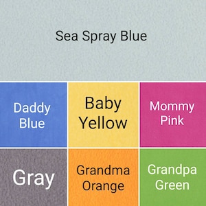 May include: A color palette featuring swatches of Sea Spray Blue, Daddy Blue, Baby Yellow, Mommy Pink, Gray, Grandma Orange, and Grandpa Green. Each color is labeled with its name in white text.