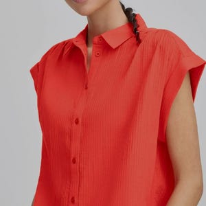 Loose-fitting cotton gauze blouse.