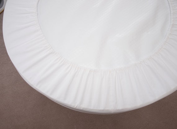 round crib mattress pad