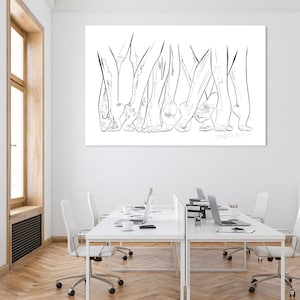 May include: A large, rectangular black and white line art print depicting multiple pairs of feet and legs. The artwork is mounted on a white wall above a series of white desks with laptops and chairs. The room has a window with a wooden frame.