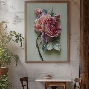 May include: A framed floral art print featuring a large, detailed rose in shades of pink, peach, and purple. The rose is the focal point, with green leaves and a thorny stem. The artwork is displayed on a light green background within a wooden frame.