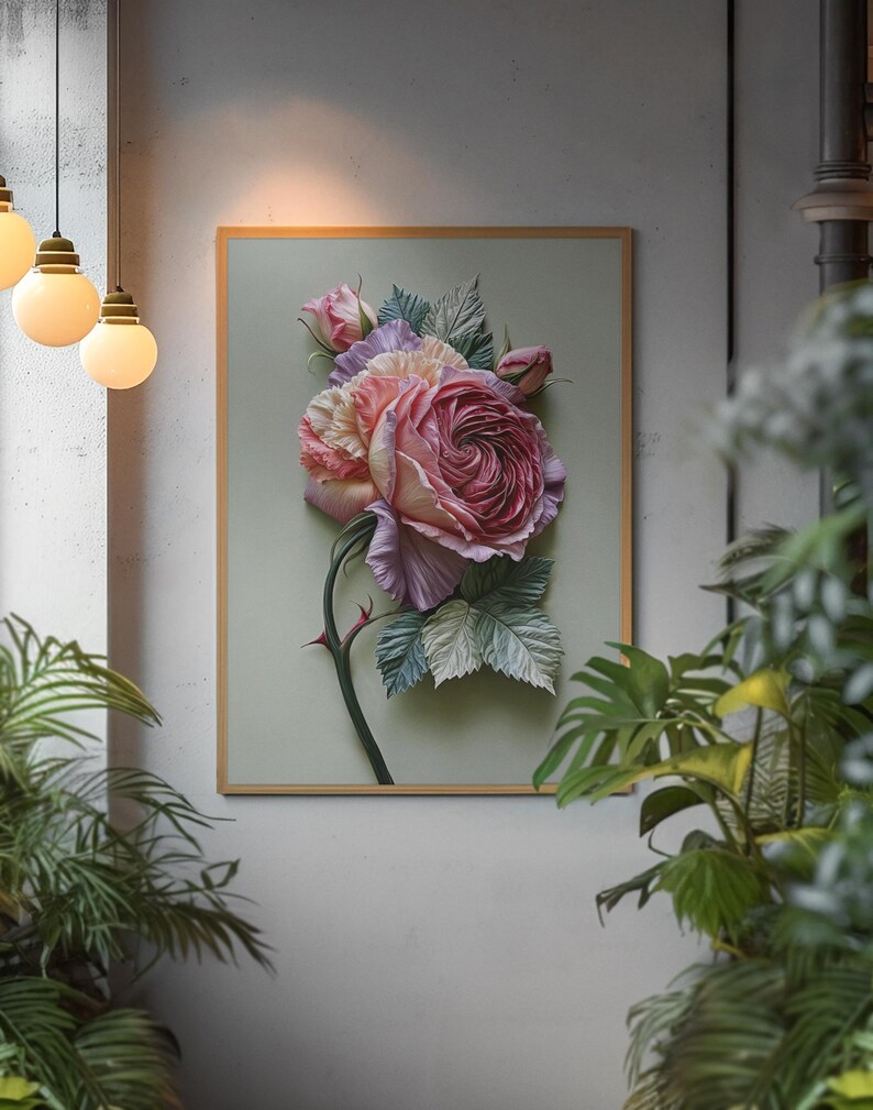 May include: A framed floral art piece featuring a large, detailed rose in shades of pink and red, with green leaves and a thorny stem. The artwork is set against a light green background within a wooden frame, creating a three-dimensional effect.