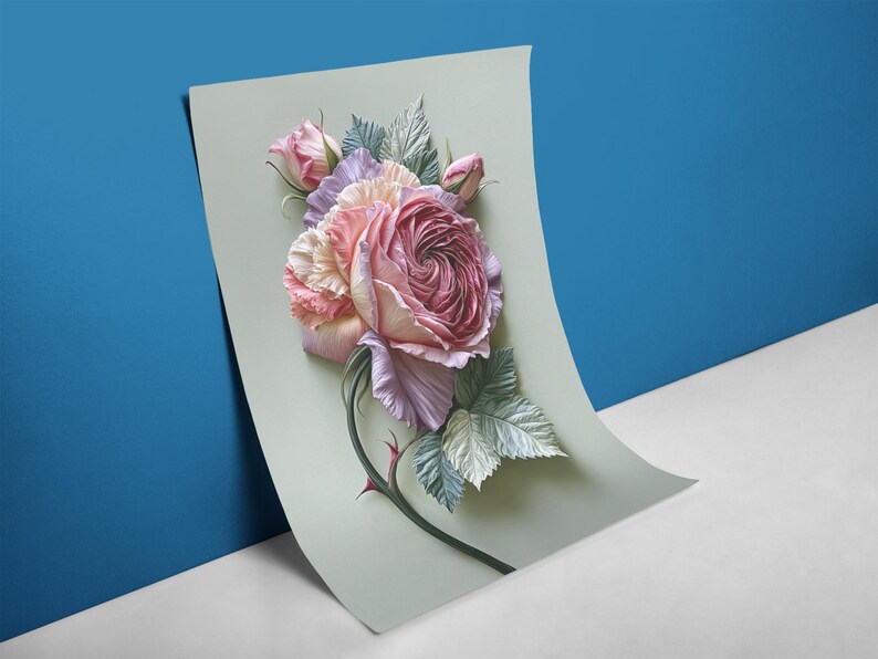 May include: A floral art print featuring a large, detailed rose in shades of pink, lavender, and cream, with green leaves and a thorny stem. The artwork is displayed on a light green paper against a blue and white background.