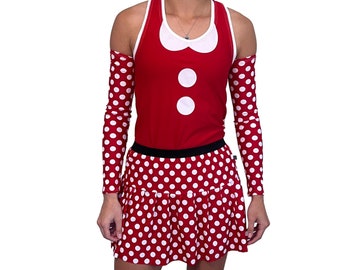 May include: Red and white polka dot dress with a red sleeveless top featuring a white collar and two white buttons. The dress has a black waistband and a white polka dot pattern.