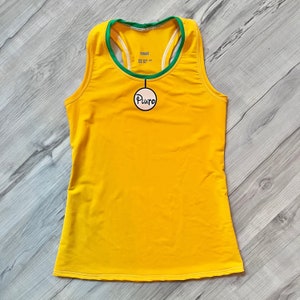 May include: Yellow athletic tank top with a green and white racerback design. The tank top has a small white tag with the word "small" on it and a round pink label with the word "Puro" on it.