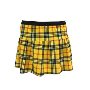May include: A yellow, black, and red plaid mini skirt with a black waistband.