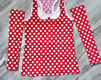 May include: Red and white polka dot sleeveless top with matching long sleeves. The top has a white collar with a bow.
