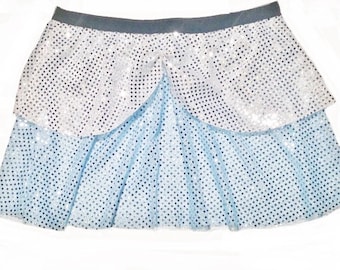 May include: A light blue and silver sequined skirt with a layered design. The skirt has a silver top layer and a light blue bottom layer. The skirt is perfect for a princess costume.