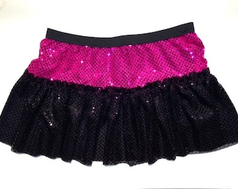 May include: A black and pink sequined skirt with a ruffled bottom. The skirt is made of a soft, stretchy material and has a comfortable elastic waistband.