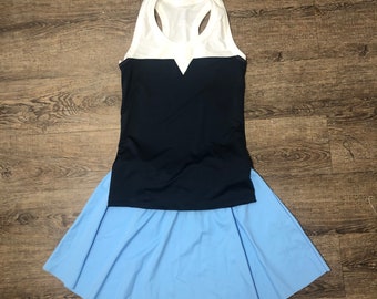 May include: A blue and white sleeveless top with a white V-shaped neckline and a blue skirt.