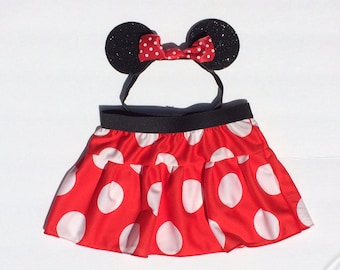 May include: Red and white polka dot skirt with a black elastic waistband and a black headband with red and white polka dot bow and black ears.