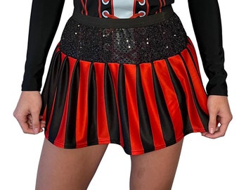 May include: A black and red striped mini skirt with a black sequined waistband.