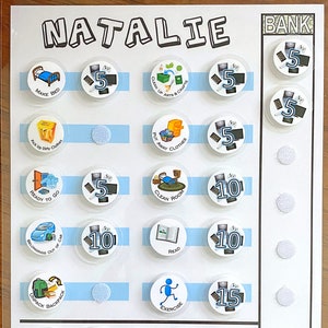 May include: A white board with blue stripes and a chart for earning points for completing chores. The chart has pictures of chores and points assigned to each chore. The chores include making the bed, cleaning up arts and crafts, putting away clothes, cleaning the room, reading, exercising, picking up outside, picking up toys, and straightening shoes and coats. The board also has a bank section with a column of circles for storing points.