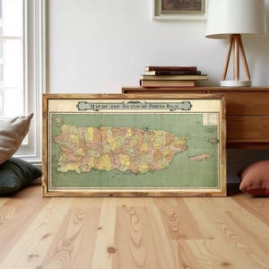 A framed vintage map of the island of Puerto Rico, depicting the country's geographical layout and boundaries.
