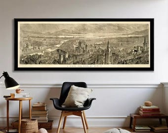 May include: A panoramic black and white print titled A BIRD'S EYE VIEW OF DUBLIN, framed in a thin black border. The detailed illustration depicts a sprawling cityscape with historic buildings, church spires, and a river winding through the center.
