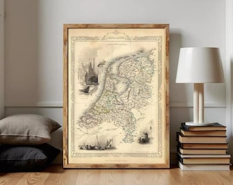 May include: A framed vintage map of Holland in sepia tones, featuring intricate cartographic details, nautical illustrations, and architectural sketches. The map is enclosed in a wooden frame with a decorative border and the text HOLLAND at the top.