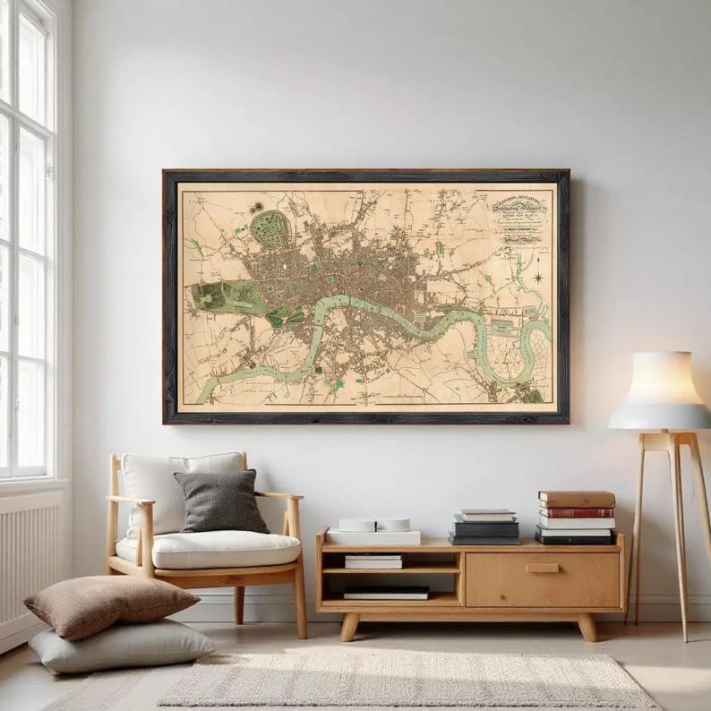 The image is a framed map of London, England, depicting the city's streets, landmarks, and surrounding areas.