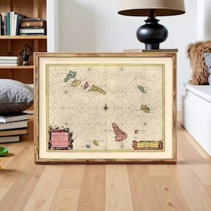 May include: A framed vintage nautical map of the Cape Verde islands featuring a cream background, black grid lines, and colored landmasses. The map includes decorative cartouches with the text Insulae Promontorii Viridis and other labels.
