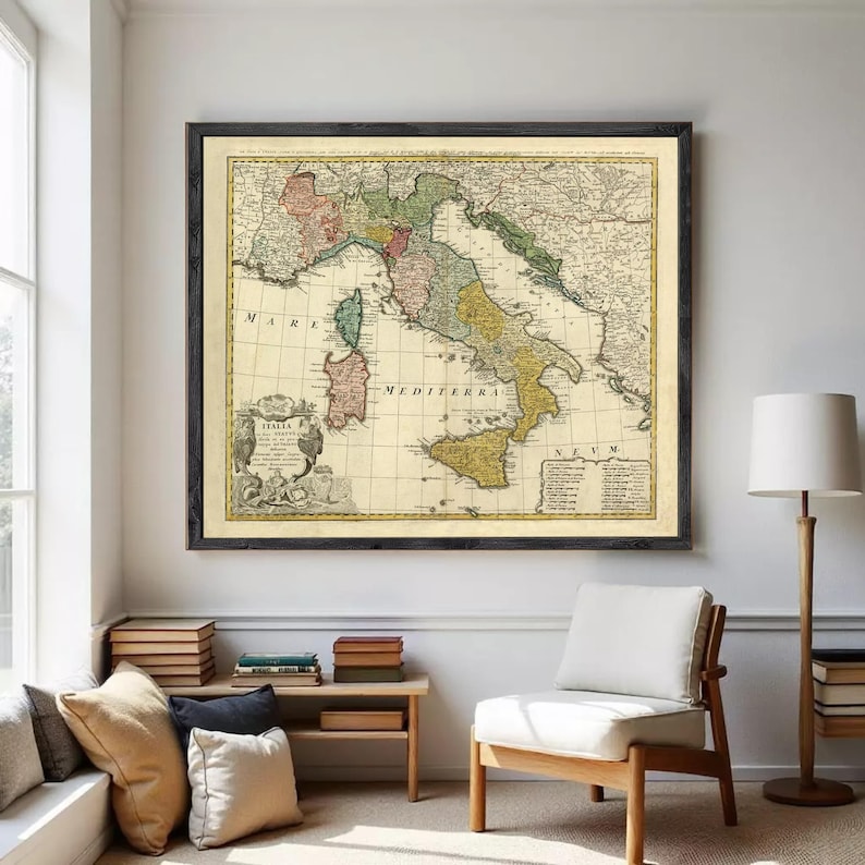 The image is a framed vintage map of Italy, showing the country's geographical layout and surrounding regions.
