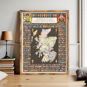 May include: A framed wall map titled Scotland of Old, featuring a central colourful map of Scotland on a dark brown background, surrounded by a border of numerous small heraldic crests and shields, with larger coats of arms at the top corners.
